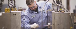 Man working manufacturing pails