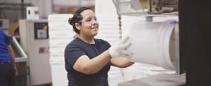 M&M Industries - Worker Inspecting Pail